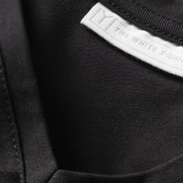 stitching detail on men's black v-neck t-shirt