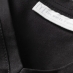 stitching detail on men's black v-neck t-shirt